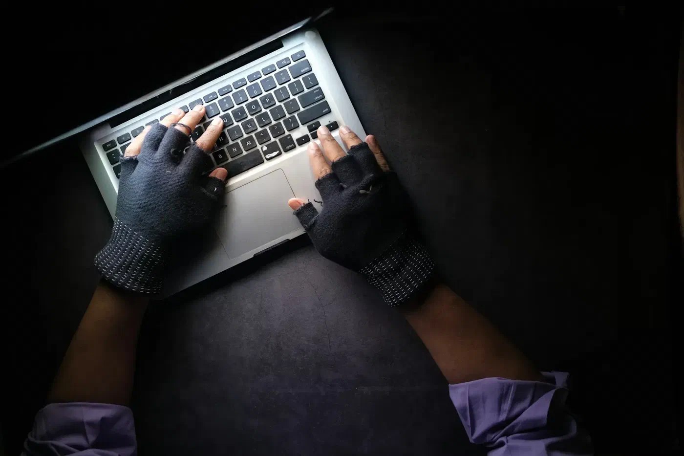 hacker typing dark room gloves