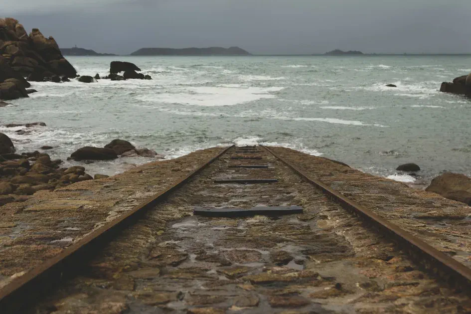 Railway track extending into the sea