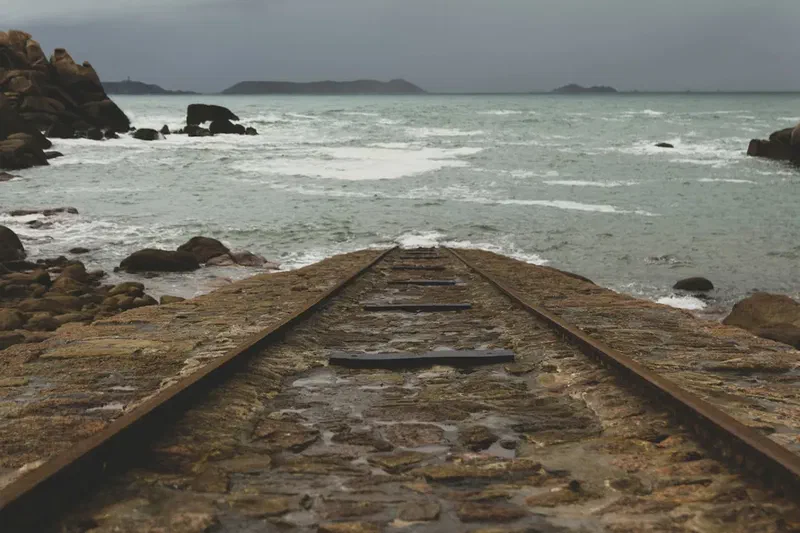 Railway track extending into the sea
