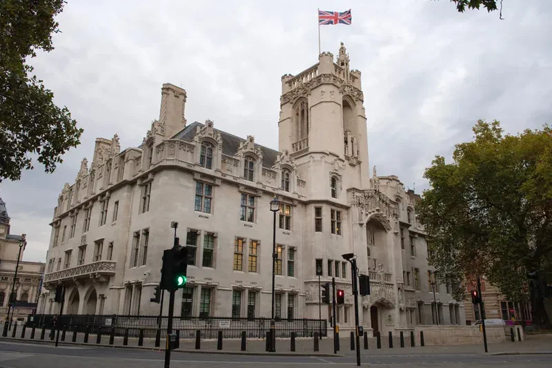 Supreme Court of the United Kingdom building in London with British flag on top
