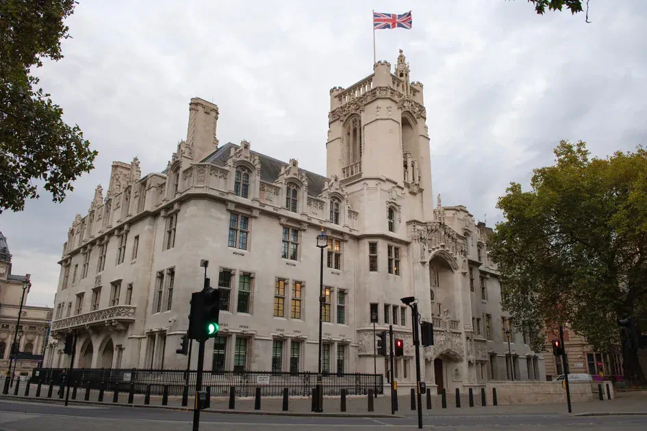 Supreme Court of the United Kingdom building in London with British flag on top