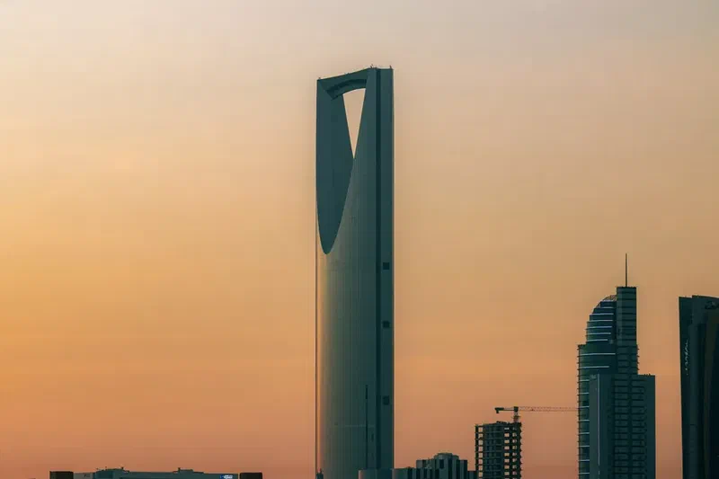 Kingdom Centre Tower in Riyadh, Saudi Arabia, photographed against a sunset sky.